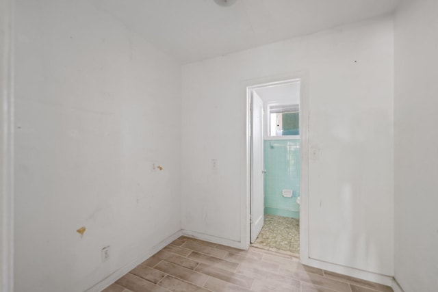 4621 N Ocean Blvd, Boynton Beach, FL 33435 - empty room with wood tiled floors