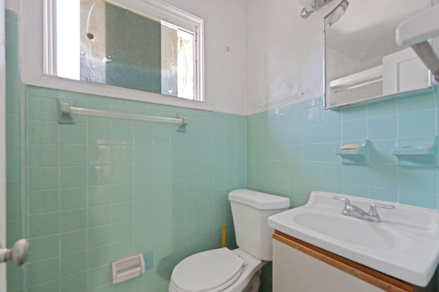 4621 N Ocean Blvd, Boynton Beach, FL 33435 - half bathroom with vanity and tile walls