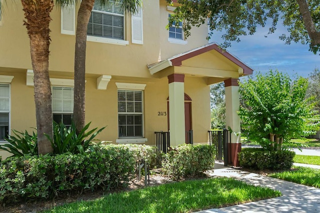 2113 SE Fern Park Dr, Port Saint Lucie, FL 34952 - doorway to property featuring stucco siding