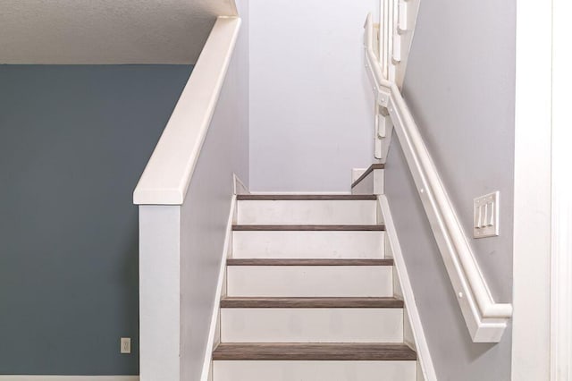 2113 SE Fern Park Dr, Port Saint Lucie, FL 34952 - stairs with a textured ceiling