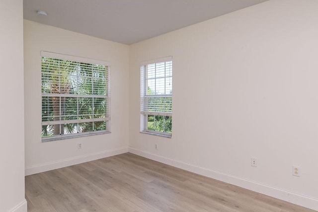 2113 SE Fern Park Dr, Port Saint Lucie, FL 34952 - unfurnished room with light wood-type flooring and a smoke detector