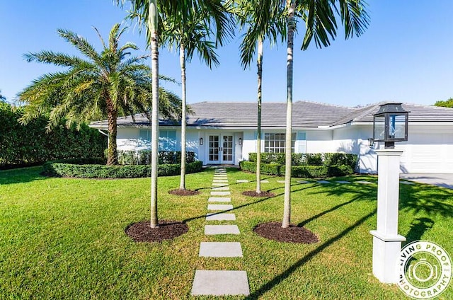 4941 S Lake Dr, Boynton Beach, FL 33436 - single story home with french doors, a garage, and a front lawn