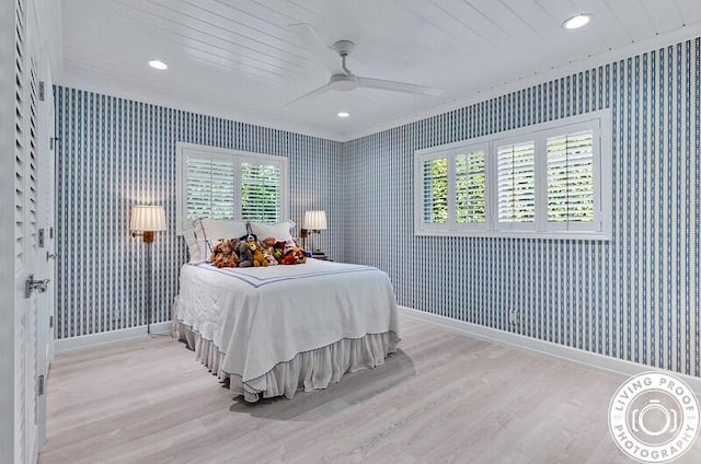 4941 S Lake Dr, Boynton Beach, FL 33436 - bedroom featuring wallpapered walls, wood finished floors, multiple windows, ornamental molding, and ceiling fan