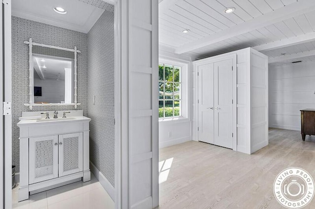 4941 S Lake Dr, Boynton Beach, FL 33436 - bathroom with beamed ceiling, wood finished floors, vanity, and recessed lighting