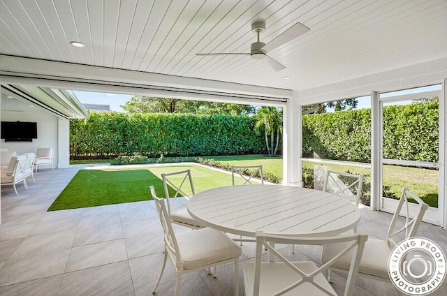 4941 S Lake Dr, Boynton Beach, FL 33436 - fenced backyard featuring outdoor dining area, a patio, and a ceiling fan
