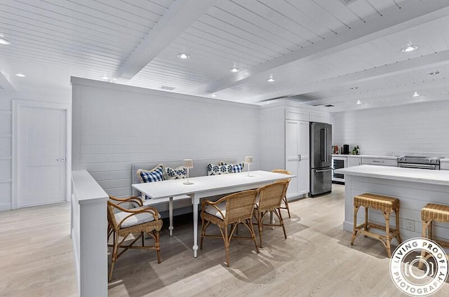 4941 S Lake Dr, Boynton Beach, FL 33436 - dining space featuring light wood-style floors, beamed ceiling, recessed lighting, and wine cooler