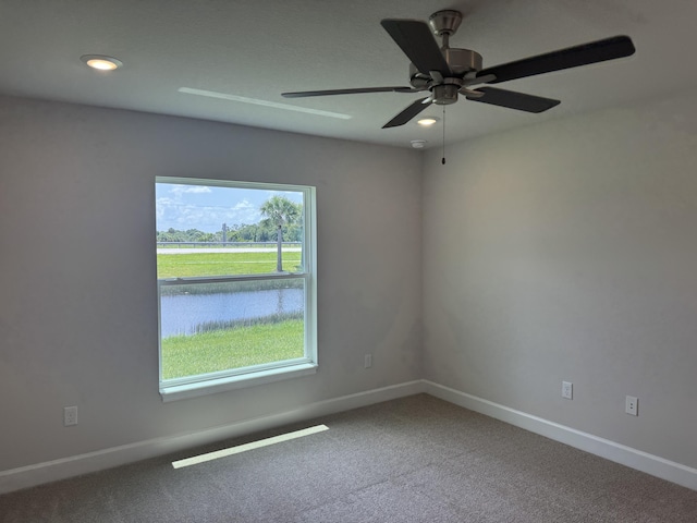 5117 Modeno St, Fort Pierce, FL 34951 - unfurnished room featuring carpet floors and ceiling fan