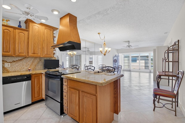 1111 Lemon Tree Ter Unit 204, Delray Beach, FL 33445 - kitchen with appliances with stainless steel finishes, custom exhaust hood, ceiling fan, a peninsula, and open floor plan
