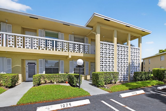 1111 Lemon Tree Ter Unit 204, Delray Beach, FL 33445 - view of property with uncovered parking