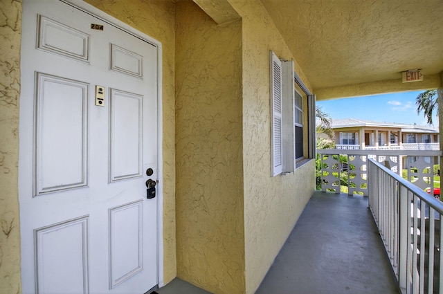 1111 Lemon Tree Ter Unit 204, Delray Beach, FL 33445 - entrance to property with stucco siding and a balcony