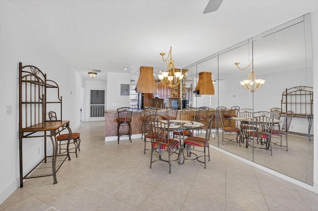 1111 Lemon Tree Ter Unit 204, Delray Beach, FL 33445 - tiled dining room featuring a chandelier, a textured ceiling, and ceiling fan
