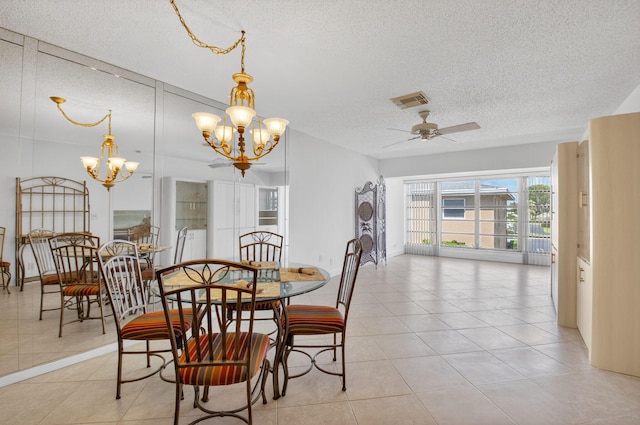 1111 Lemon Tree Ter Unit 204, Delray Beach, FL 33445 - dining area featuring a textured ceiling, a chandelier, a ceiling fan, and light tile patterned floors