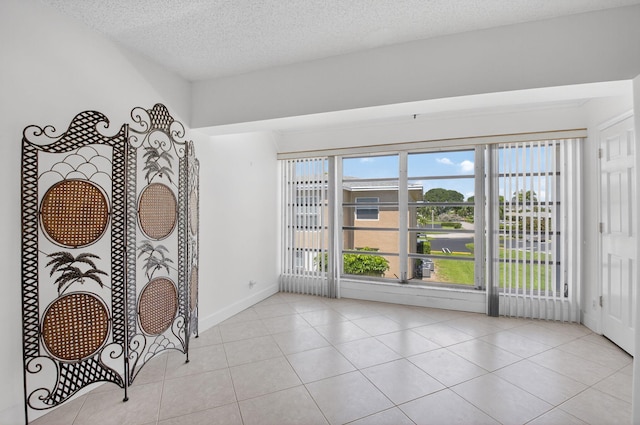 1111 Lemon Tree Ter Unit 204, Delray Beach, FL 33445 - empty room with tile patterned floors and a textured ceiling