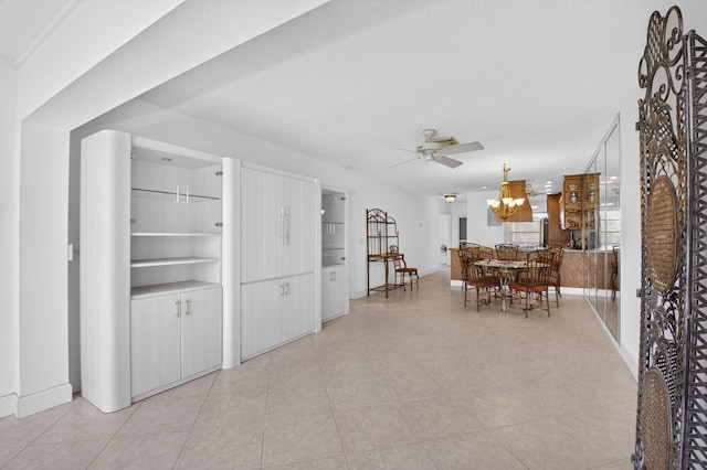 1111 Lemon Tree Ter Unit 204, Delray Beach, FL 33445 - dining room featuring ceiling fan, plenty of natural light, a chandelier, and light tile patterned flooring