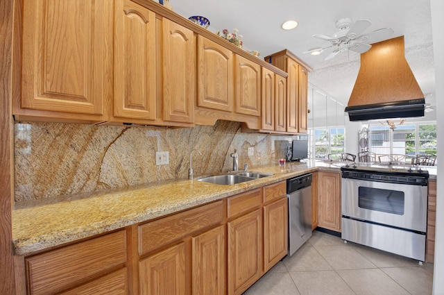 1111 Lemon Tree Ter Unit 204, Delray Beach, FL 33445 - kitchen with stainless steel appliances, backsplash, light tile patterned floors, light stone countertops, and custom exhaust hood