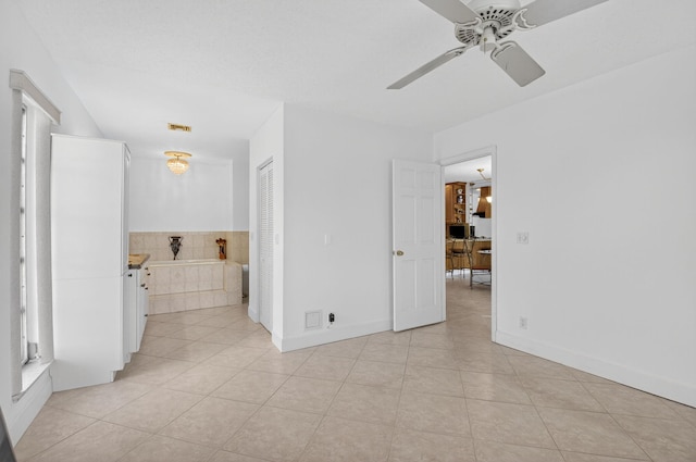 1111 Lemon Tree Ter Unit 204, Delray Beach, FL 33445 - empty room featuring light tile patterned flooring and ceiling fan