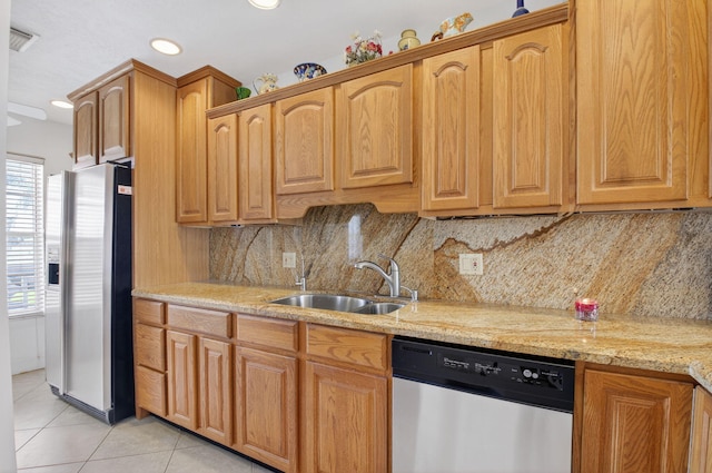 1111 Lemon Tree Ter Unit 204, Delray Beach, FL 33445 - kitchen featuring appliances with stainless steel finishes, healthy amount of natural light, light tile patterned floors, light stone counters, and recessed lighting