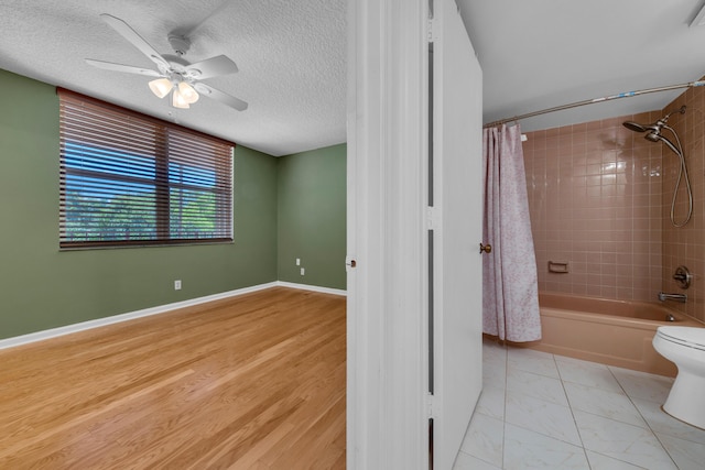 14623 Bonaire Blvd Unit 203, Delray Beach, FL 33446 - spare room featuring a ceiling fan and a textured ceiling