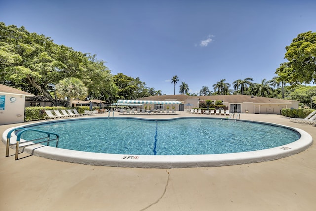 14623 Bonaire Blvd Unit 203, Delray Beach, FL 33446 - community pool with a patio area