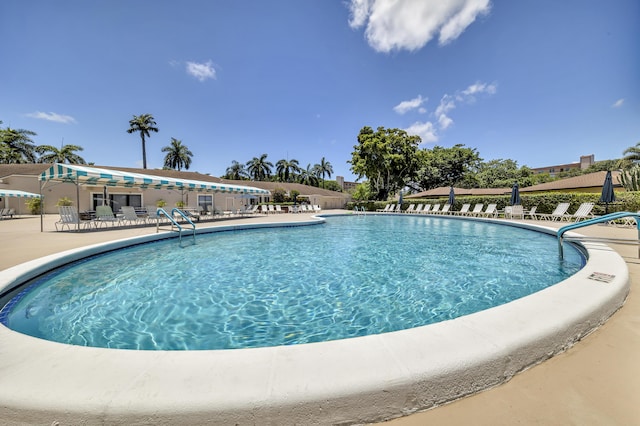 14623 Bonaire Blvd Unit 203, Delray Beach, FL 33446 - community pool featuring a patio area