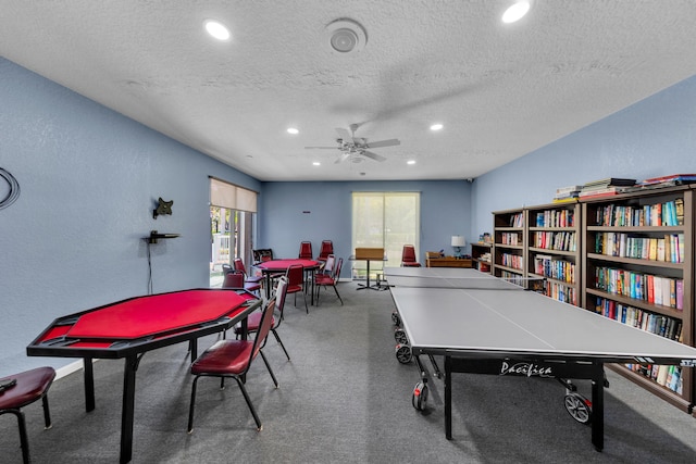 14623 Bonaire Blvd Unit 203, Delray Beach, FL 33446 - rec room featuring a textured ceiling, carpet flooring, recessed lighting, ceiling fan, and a textured wall