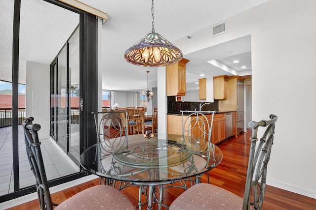 4000 N Ocean Dr Unit 204, Singer Island, FL 33404 - dining space featuring dark wood-style floors and recessed lighting