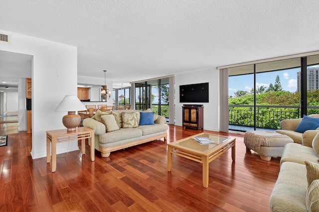 4000 N Ocean Dr Unit 204, Singer Island, FL 33404 - living room featuring a textured ceiling, wood finished floors, and expansive windows
