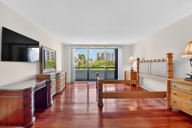 4000 N Ocean Dr Unit 204, Singer Island, FL 33404 - bedroom featuring access to exterior and dark wood finished floors