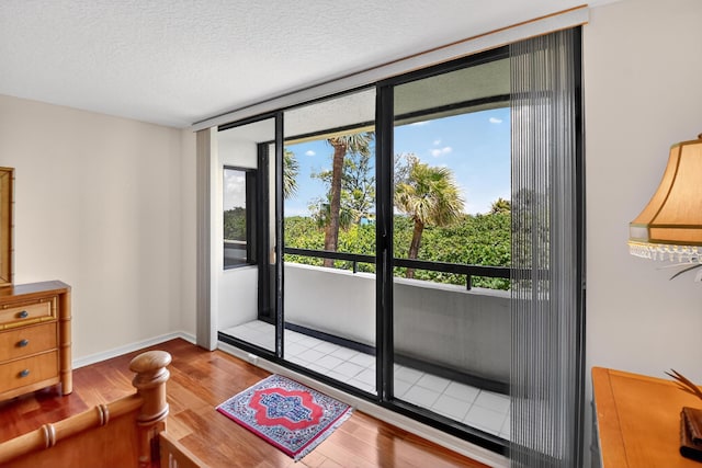 4000 N Ocean Dr Unit 204, Singer Island, FL 33404 - living room featuring wood finished floors and a textured ceiling