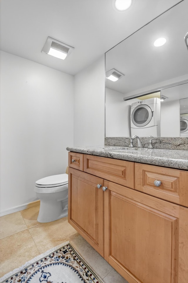 4000 N Ocean Dr Unit 204, Singer Island, FL 33404 - bathroom with stacked washer and clothes dryer and vanity