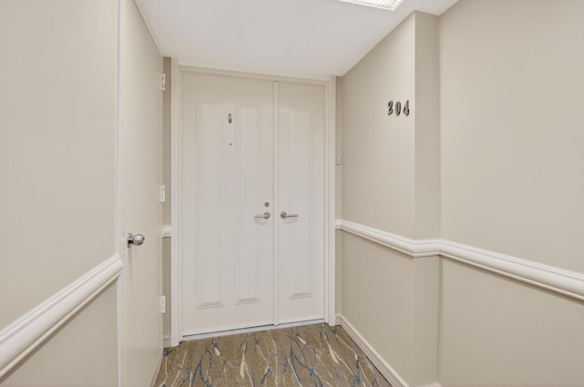 4000 N Ocean Dr Unit 204, Singer Island, FL 33404 - doorway to outside featuring baseboards