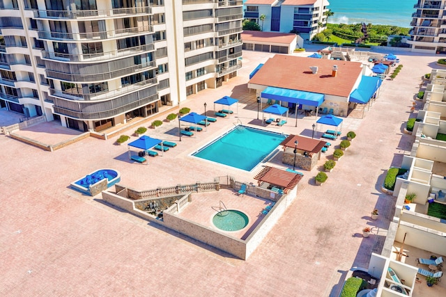 4000 N Ocean Dr Unit 204, Singer Island, FL 33404 - drone / aerial view of a pool and a nearby body of water