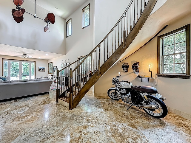 12471 SW 1st St, Plantation, FL 33325 - staircase featuring a towering ceiling, stone finish floors, and ceiling fan