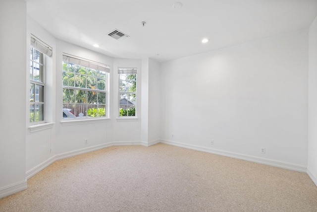 326 Tuxedo Ln, West Palm Beach, FL 33401 - spare room with light carpet, plenty of natural light, recessed lighting, and a pendent fire sprinkler