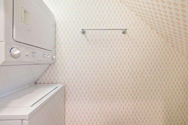 326 Tuxedo Ln, West Palm Beach, FL 33401 - washroom featuring stacked washer / dryer and wallpapered walls