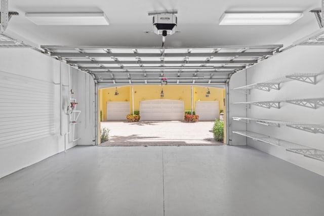 326 Tuxedo Ln, West Palm Beach, FL 33401 - garage featuring a garage door opener