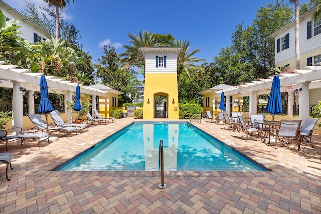 326 Tuxedo Ln, West Palm Beach, FL 33401 - community pool with a pergola and a patio