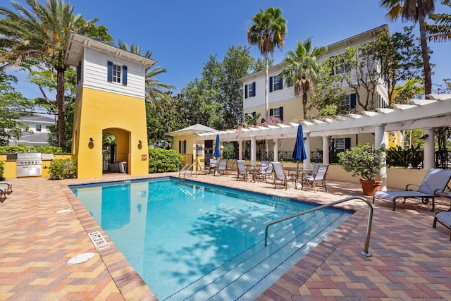 326 Tuxedo Ln, West Palm Beach, FL 33401 - community pool featuring a pergola, a patio, and a grill