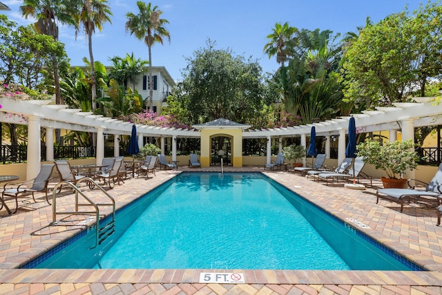 326 Tuxedo Ln, West Palm Beach, FL 33401 - community pool with a pergola and a patio area