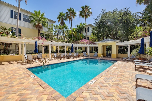 326 Tuxedo Ln, West Palm Beach, FL 33401 - community pool featuring a pergola and a patio