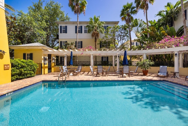 326 Tuxedo Ln, West Palm Beach, FL 33401 - community pool with a pergola and a patio