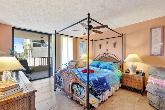 2400 S Ocean Dr Unit 4223, Fort Pierce, FL 34949 - bedroom featuring access to outside, a textured ceiling, light tile patterned flooring, and a ceiling fan