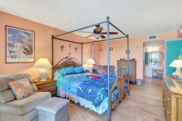 2400 S Ocean Dr Unit 4223, Fort Pierce, FL 34949 - tiled bedroom featuring a textured ceiling and a ceiling fan