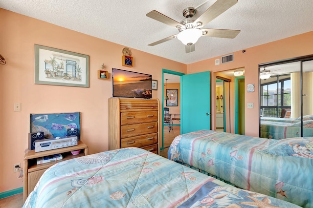 2400 S Ocean Dr Unit 4223, Fort Pierce, FL 34949 - bedroom featuring a textured ceiling and a ceiling fan