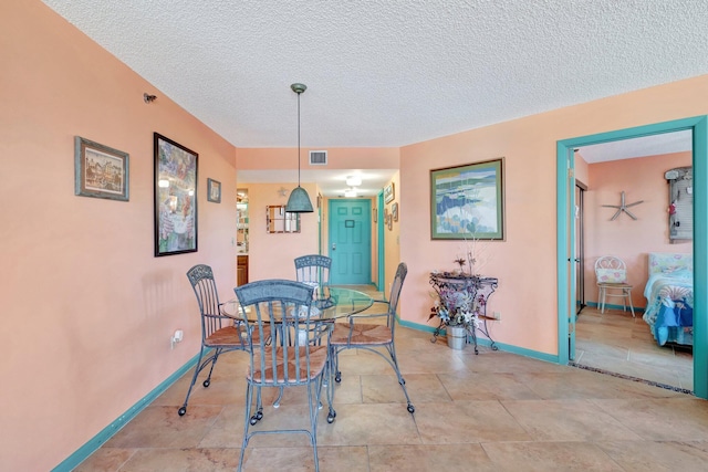 2400 S Ocean Dr Unit 4223, Fort Pierce, FL 34949 - dining space featuring a textured ceiling