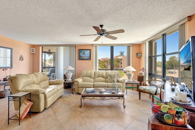 2400 S Ocean Dr Unit 4223, Fort Pierce, FL 34949 - living area featuring a ceiling fan, healthy amount of natural light, a textured ceiling, and a wall of windows