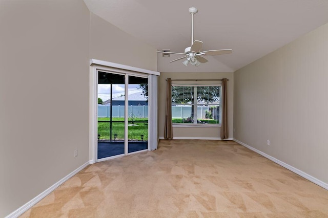 2062 SW Scorpio Ln, Port Saint Lucie, FL 34984 - spare room featuring a ceiling fan, light carpet, and vaulted ceiling