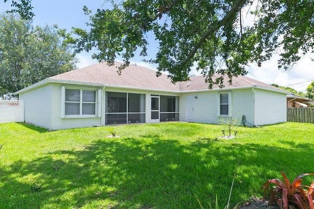 2062 SW Scorpio Ln, Port Saint Lucie, FL 34984 - back of property with stucco siding, a shingled roof, and a sunroom