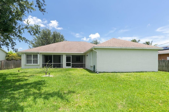 2062 SW Scorpio Ln, Port Saint Lucie, FL 34984 - rear view of house with a shingled roof, stucco siding, and a sunroom