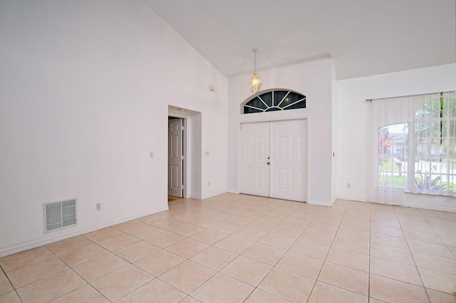 2062 SW Scorpio Ln, Port Saint Lucie, FL 34984 - entrance foyer with light tile patterned flooring and high vaulted ceiling
